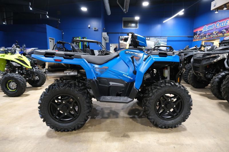 2025 POLARIS SPORTSMAN 570 TRAIL ELECTRIC BLUE in a ELECTRIC BLUE exterior color. Family PowerSports (877) 886-1997 familypowersports.com 