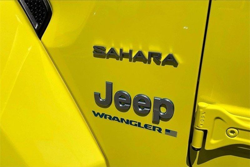 2024 Jeep Wrangler 4-door Sahara 4xe in a High Velocity Clear Coat exterior color and Blackinterior. I-10 Chrysler Dodge Jeep Ram (760) 565-5160 pixelmotiondemo.com 