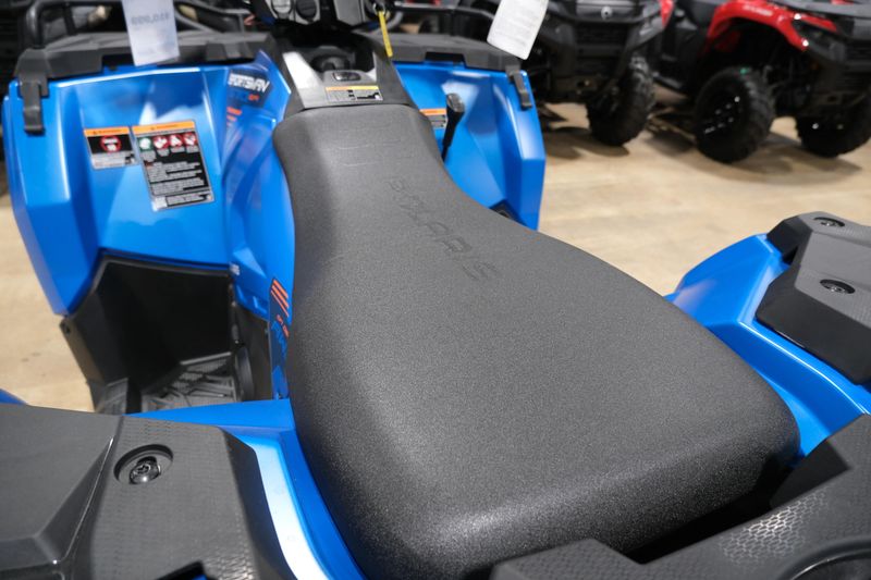 2025 POLARIS SPORTSMAN 570 TRAIL ELECTRIC BLUE in a ELECTRIC BLUE exterior color. Family PowerSports (877) 886-1997 familypowersports.com 