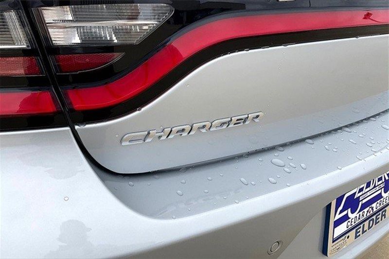 2023 Dodge Charger SXT Rwd in a Triple Nickel exterior color and Blackinterior. Elder CDJR Cedar Creek 430-558-0679 eldercedarcreek.com 
