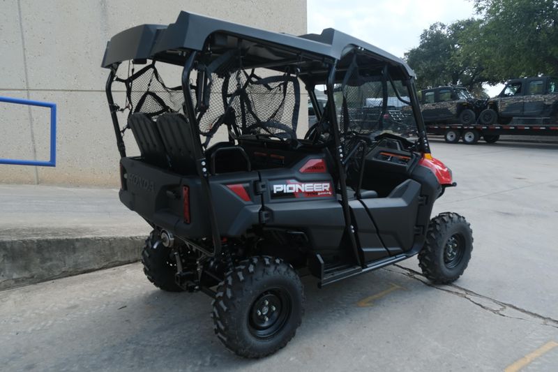 NEW 2026 HONDA PIONEER 7004  in a HERO RED exterior color. Family PowerSports (877) 886-1997 familypowersports.com