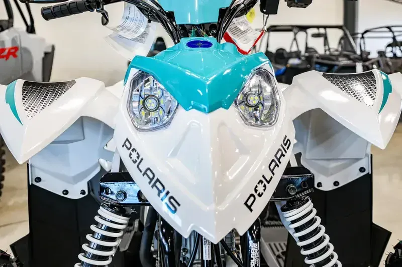 2025 Polaris OUTLAW 110 EFI BRIGHT WHITE AND RADIANT GREENImage 4