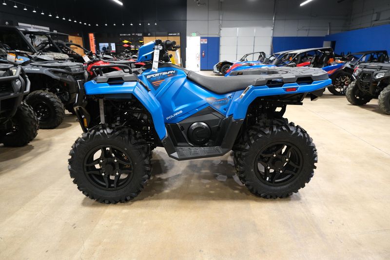 2025 POLARIS SPORTSMAN 570 TRAIL ELECTRIC BLUE in a ELECTRIC BLUE exterior color. Family PowerSports (877) 886-1997 familypowersports.com 