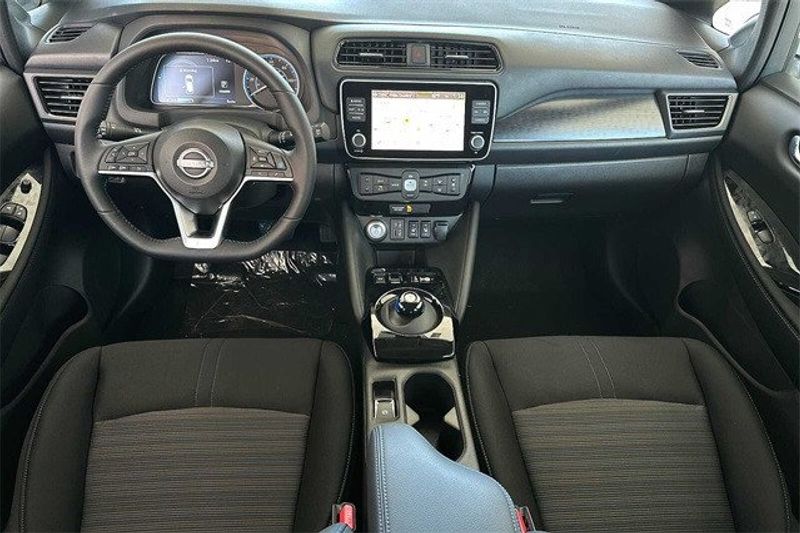 2023 Nissan Leaf SV Plus in a Pearl White Tri Coat exterior color and Blackinterior. BEACH BLVD OF CARS beachblvdofcars.com 