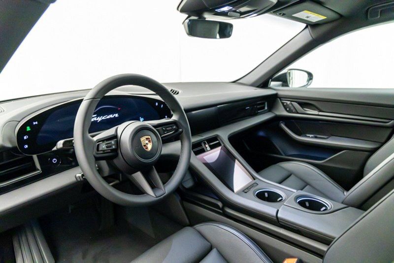 2023 Porsche Taycan  in a Jet Black Metallic exterior color and Blackinterior. Lotus Manhattan 347-395-5714 lotusmanhattan.com 