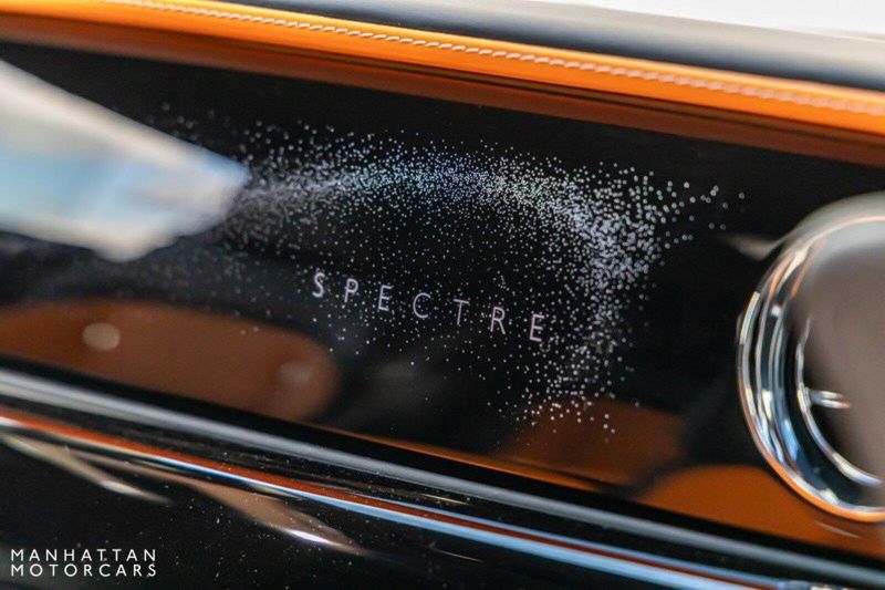 2024 Rolls-Royce Spectre  in a Tempest Grey exterior color and Black with Mandarin Accentsinterior. Lotus Manhattan 347-395-5714 lotusmanhattan.com 