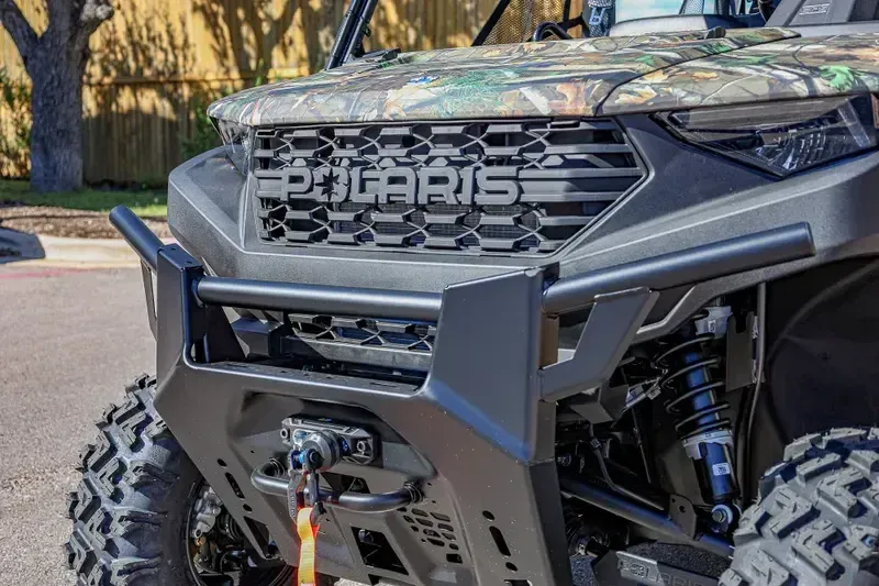 2025 POLARIS RANGER CREW 1000 PREMIUM PURSUIT CAMO in a POLARIS PURSUIT CAMO exterior color. Family PowerSports (877) 886-1997 familypowersports.com 