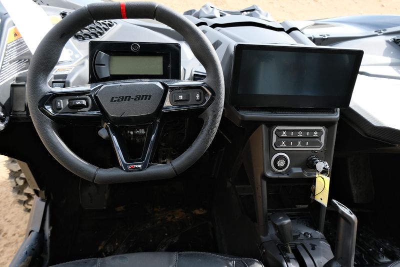 NEW 2026 CAN-AM MAVERICK X3 X RS TURBO RR WITH 1025 INCH TOUCHSCREEN  in a TRIPLE BLACK exterior color. Family PowerSports (877) 886-1997 familypowersports.com 