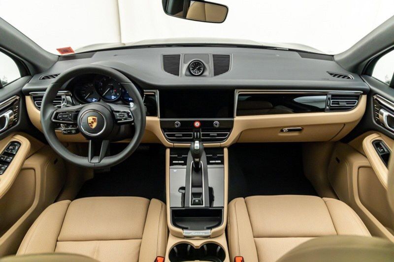 2024 Porsche Macan  in a Black exterior color and Black/Mojave Beigeinterior. Lotus Manhattan 347-395-5714 lotusmanhattan.com 