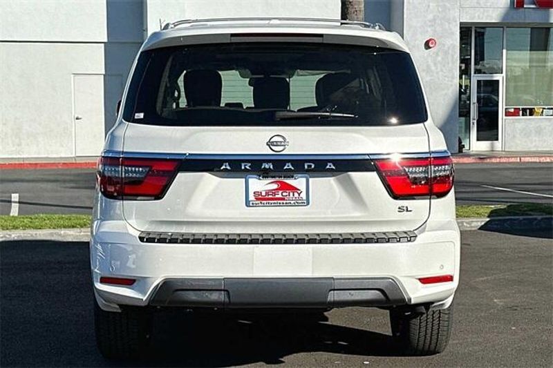 2024 Nissan Armada SL in a Aspen White Tri Coat exterior color and Almondinterior. BEACH BLVD OF CARS beachblvdofcars.com 