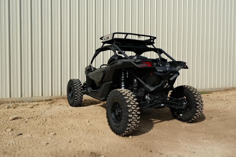 NEW 2026 CAN-AM MAVERICK X3 X RS TURBO RR WITH 1025 INCH TOUCHSCREEN  in a TRIPLE BLACK exterior color. Family PowerSports (877) 886-1997 familypowersports.com 