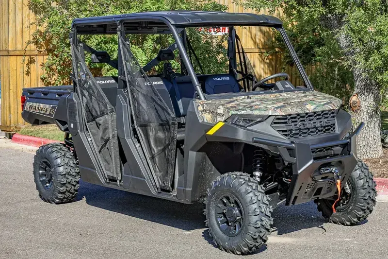 2025 POLARIS RANGER CREW 1000 PREMIUM PURSUIT CAMO in a POLARIS PURSUIT CAMO exterior color. Family PowerSports (877) 886-1997 familypowersports.com 