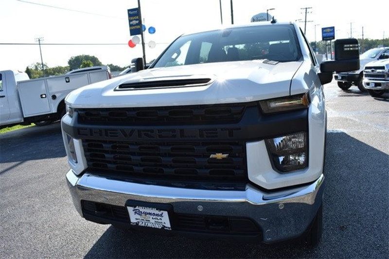 2023 Chevrolet Silverado 2500HD Work Truck in a Summit White exterior color and Blackinterior. Raymond Auto Group 888-703-9950 raymonddeals.com 