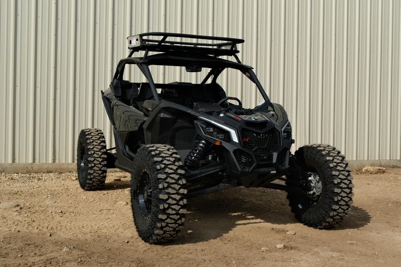NEW 2026 CAN-AM MAVERICK X3 X RS TURBO RR WITH 1025 INCH TOUCHSCREEN  in a TRIPLE BLACK exterior color. Family PowerSports (877) 886-1997 familypowersports.com 