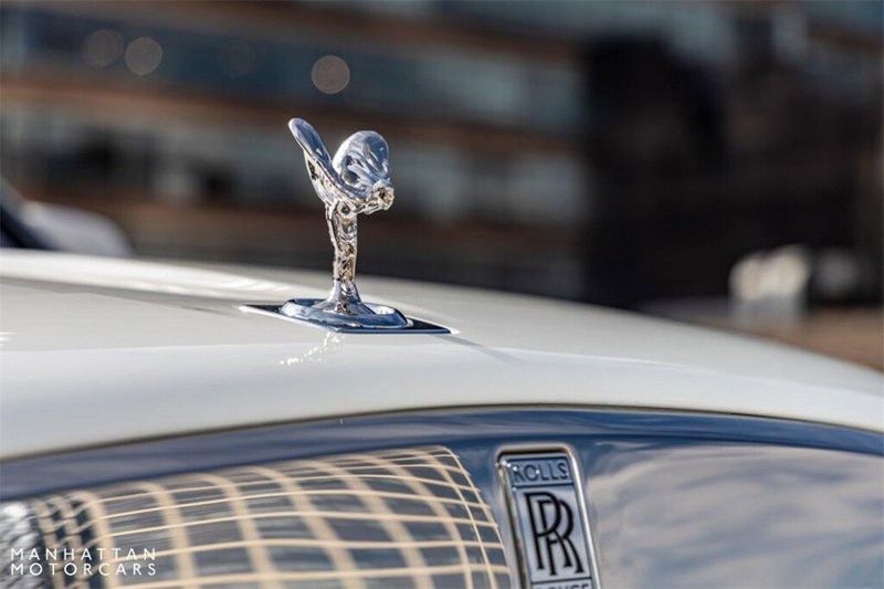 2024 Rolls-Royce Cullinan Silver Badge in a Arctic White exterior color and Black with Charles Blue Accentsinterior. Lotus Manhattan 347-395-5714 lotusmanhattan.com 