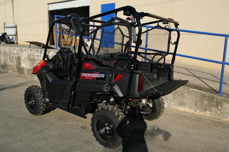 NEW 2026 HONDA PIONEER 7004  in a HERO RED exterior color. Family PowerSports (877) 886-1997 familypowersports.com