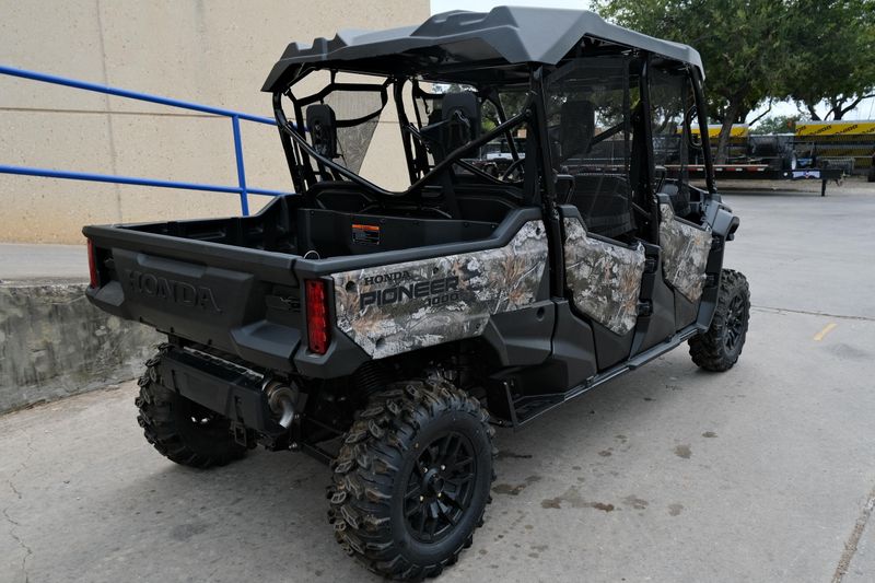NEW 2025 HONDA PIONEER 10006 DELUXE CREW  in a TRUETIMBER ATERA CAMO exterior color. Family PowerSports (877) 886-1997 familypowersports.com 