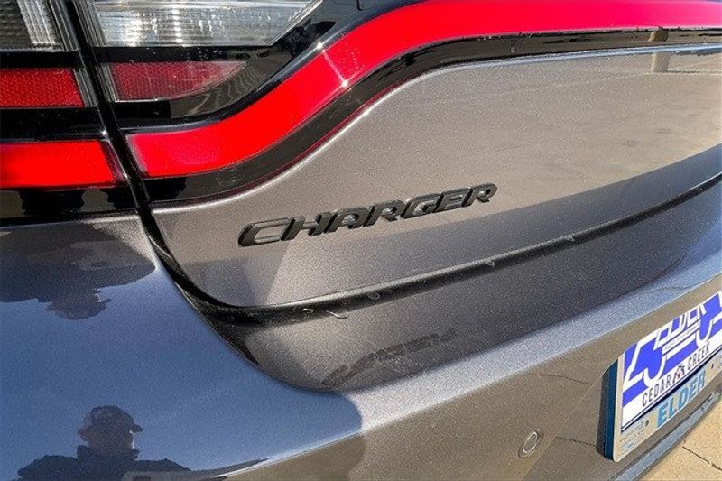 2023 Dodge Charger SXT Rwd in a Granite exterior color and Blackinterior. Elder CDJR Cedar Creek 430-558-0679 eldercedarcreek.com 