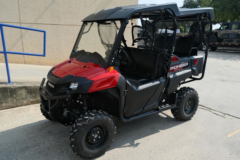 NEW 2026 HONDA PIONEER 7004  in a HERO RED exterior color. Family PowerSports (877) 886-1997 familypowersports.com