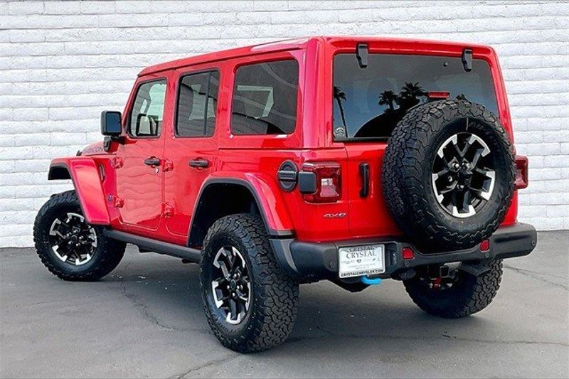 2024 Jeep Wrangler 4-door Rubicon X 4xe in a Firecracker Red Clear Coat exterior color and Blackinterior. Crystal Chrysler Jeep Dodge Ram (760) 507-2975 pixelmotiondemo.com 