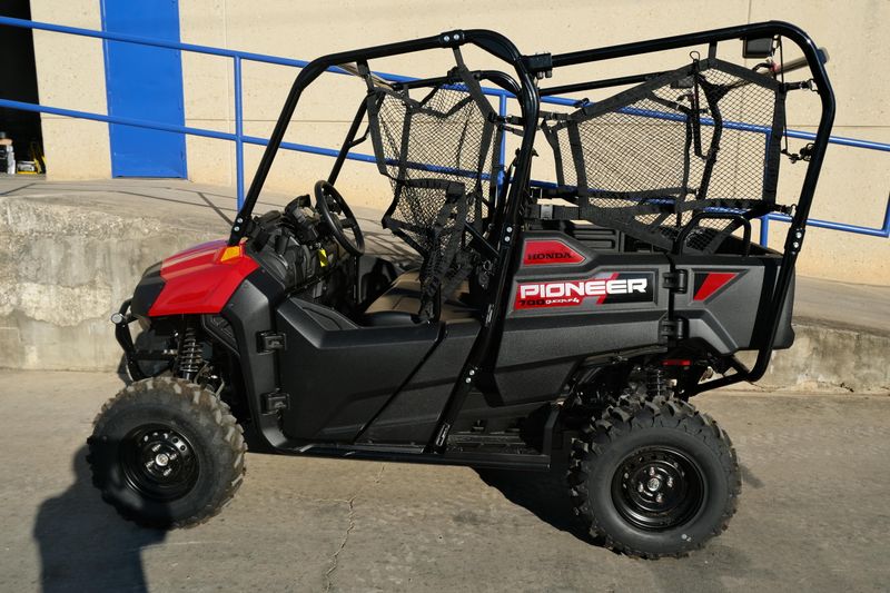 NEW 2026 HONDA PIONEER 7004  in a HERO RED exterior color. Family PowerSports (877) 886-1997 familypowersports.com