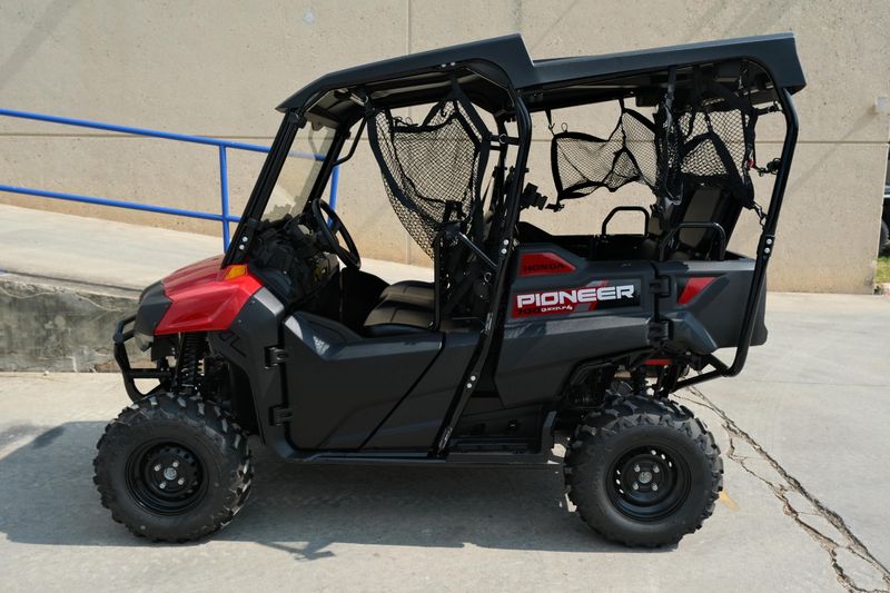 NEW 2026 HONDA PIONEER 7004  in a HERO RED exterior color. Family PowerSports (877) 886-1997 familypowersports.com