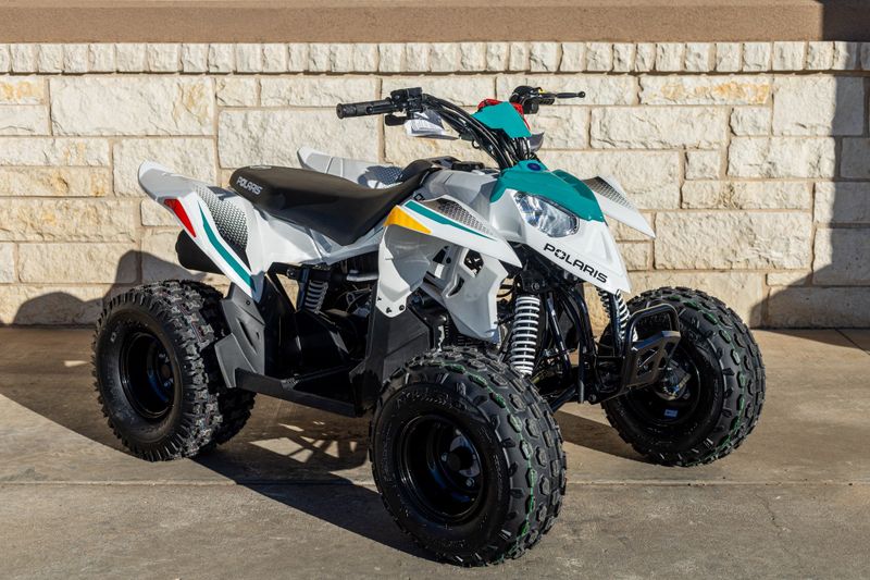 2024 POLARIS ATV24OTLW 110WHTRAD GRN in a WHITE-GREEN exterior color. Family PowerSports (877) 886-1997 familypowersports.com 