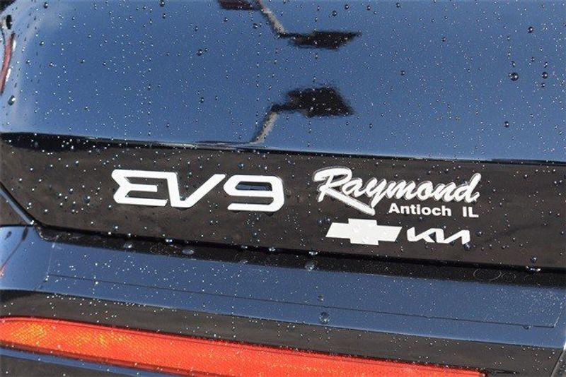 2024 Kia EV9 Land in a Aurora Blue exterior color and Bwn/Blk Two Tone Syntex Linterior. Raymond Auto Group 888-703-9950 raymonddeals.com 