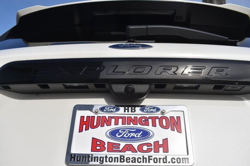2023 Ford Explorer ST in a White Metallic exterior color and Ebonyinterior. BEACH BLVD OF CARS beachblvdofcars.com 