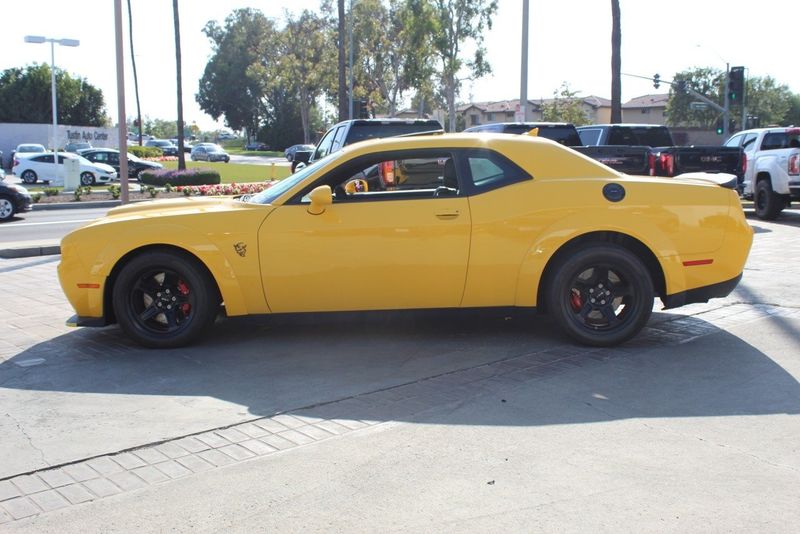 2018 Dodge Challenger SRT Demon in a Yellow Jacket exterior color and Blackinterior. BEACH BLVD OF CARS beachblvdofcars.com 