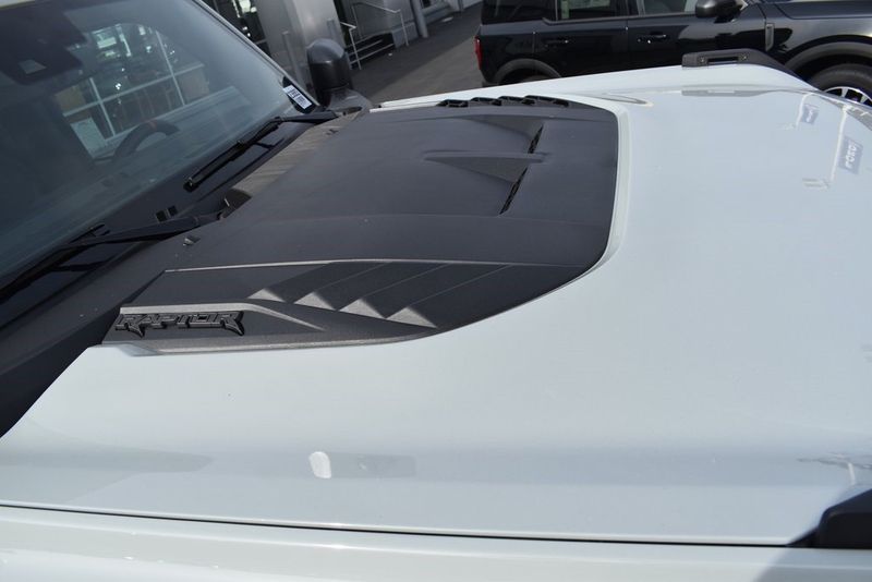 2023 Ford Bronco Raptor in a Cactus Gray exterior color and Black Onyxinterior. BEACH BLVD OF CARS beachblvdofcars.com 