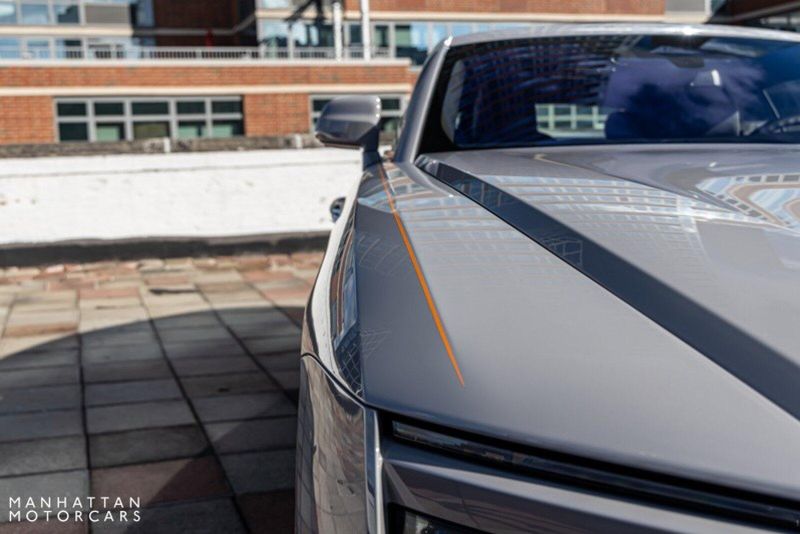 2024 Rolls-Royce Spectre  in a Tempest Grey exterior color and Black with Mandarin Accentsinterior. Lotus Manhattan 347-395-5714 lotusmanhattan.com 