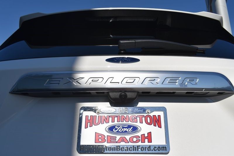 2023 Ford Explorer Platinum in a Star White Metallic Tri Coat exterior color and Ebonyinterior. BEACH BLVD OF CARS beachblvdofcars.com 