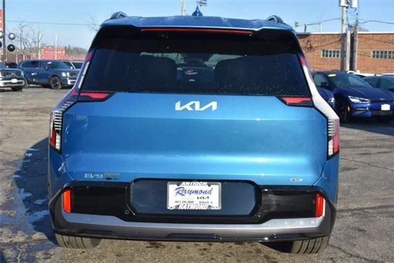 2024 Kia EV9 GT-Line in a Ocean Blue exterior color and Brown/Blackinterior. Raymond Auto Group 888-703-9950 raymonddeals.com 