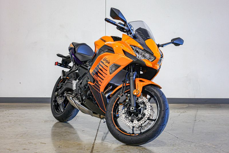 2025 KAWASAKI NINJA 650 ABS CANDY STEEL FURNACE ORANGE AND METALLIC SPARK BLACK AND METALLIC ROYAL PURPLE 