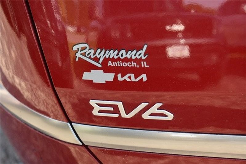 2023 Kia EV6 Wind in a Runway Red exterior color and Blackinterior. Raymond Auto Group 888-703-9950 raymonddeals.com 