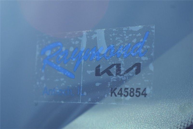 2024 Kia Niro EX Touring in a Red exterior color and Charcoal & Vegan Linterior. Raymond Auto Group 888-703-9950 raymonddeals.com 