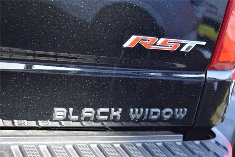 2024 Chevrolet Silverado 1500 RST in a Black exterior color and Blackinterior. Raymond Auto Group 888-703-9950 raymonddeals.com 