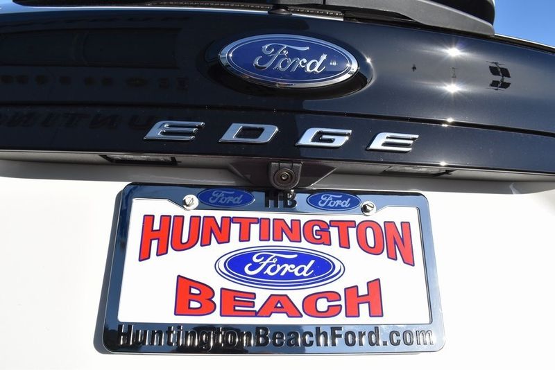 2024 Ford Edge Titanium in a Star White Metallic Tri Coat exterior color and Medium Soft Ceramicinterior. BEACH BLVD OF CARS beachblvdofcars.com 