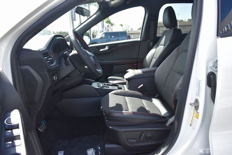 2023 Ford Escape ST-Line in a Star White Metallic Tri Coat exterior color and Ebony With Red Stitchinginterior. BEACH BLVD OF CARS beachblvdofcars.com 