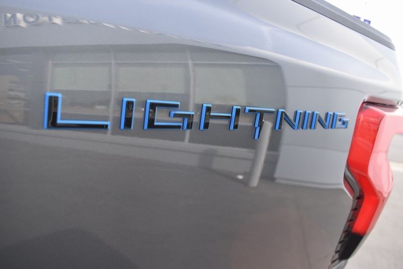 2023 Ford F-150 Lightning XLT in a Carbonized Gray Metallic exterior color and Medium Dark Slateinterior. BEACH BLVD OF CARS beachblvdofcars.com 