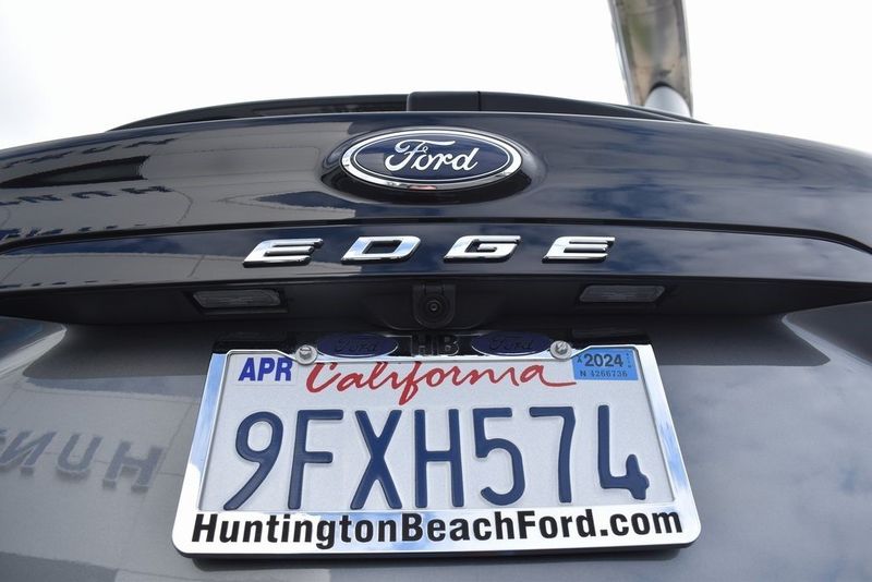 2023 Ford Edge SEL in a Carbonized Gray Metallic exterior color and Ebonyinterior. BEACH BLVD OF CARS beachblvdofcars.com 
