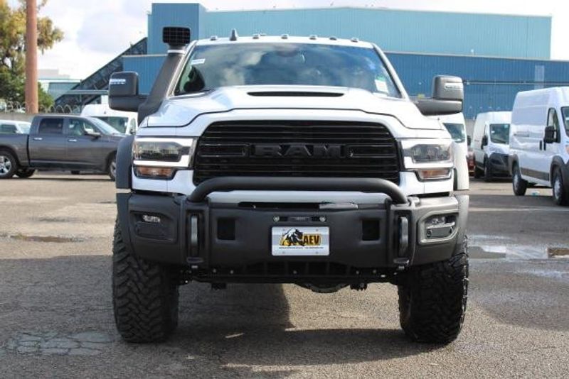 2023 RAM 2500 Laramie Crew Cab 4x4 in a Bright White exterior color and Blackinterior. BEACH BLVD OF CARS beachblvdofcars.com 