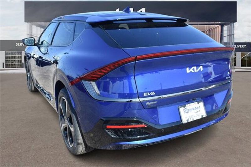 2024 Kia EV6 GT-Line in a Yacht Blue exterior color and Blackinterior. Raymond Auto Group 888-703-9950 raymonddeals.com 