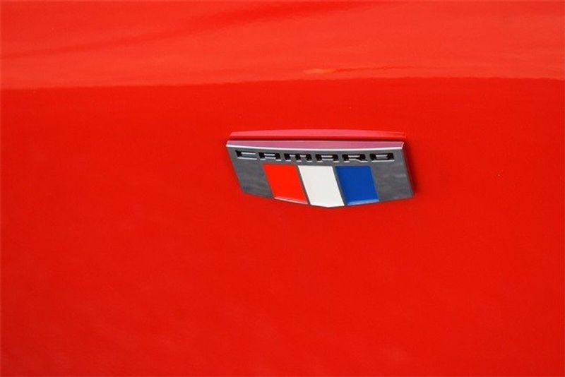 2024 Chevrolet Camaro 1LT in a Red Hot exterior color and Jet Blackinterior. Raymond Auto Group 888-703-9950 raymonddeals.com 
