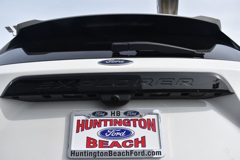 2023 Ford Explorer ST in a Star White Metallic Tri Coat exterior color and Ebonyinterior. BEACH BLVD OF CARS beachblvdofcars.com 
