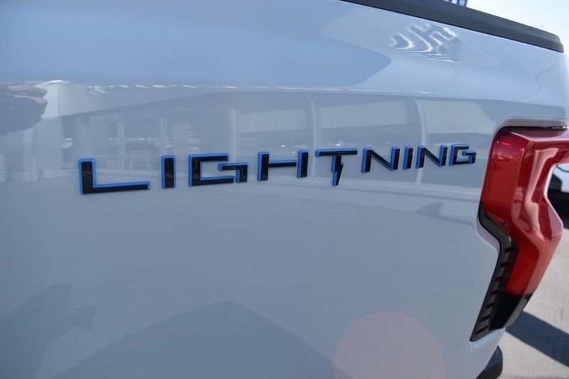 2023 Ford F-150 Lightning XLT in a Avalanche exterior color and Medium Dark Slateinterior. BEACH BLVD OF CARS beachblvdofcars.com 