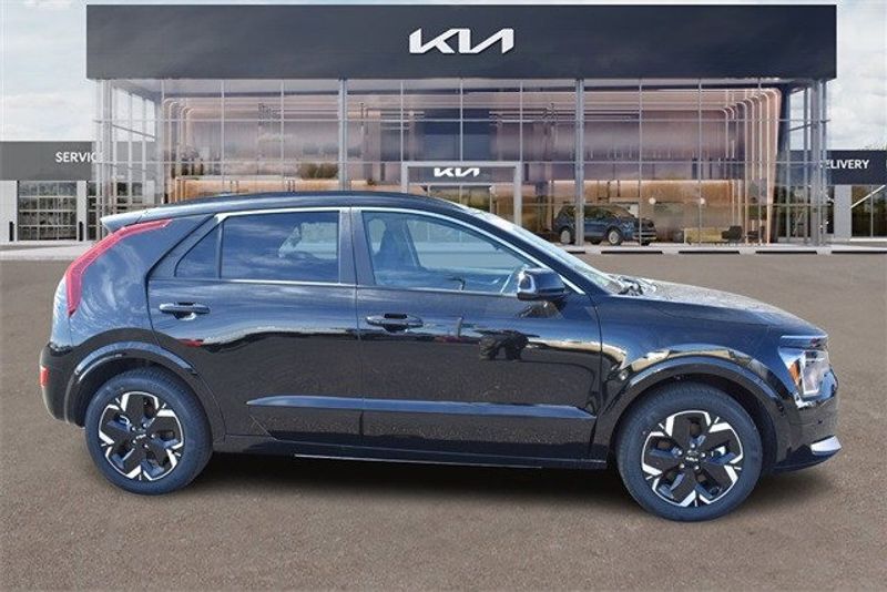 2024 Kia Niro EV Wind in a Aurora Black exterior color and Charcoalinterior. Raymond Auto Group 888-703-9950 raymonddeals.com 