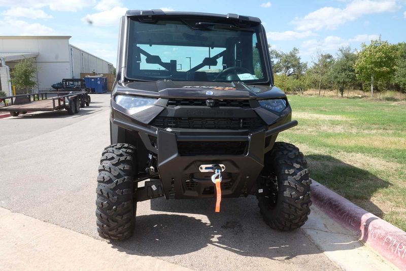 2024 POLARIS RANGER CREW XP 1000 NORTHSTAR ULTIMATE  SUPER GRAPHITE WITH ORANGE BURST ACCENTS in a GRAY exterior color. Family PowerSports (877) 886-1997 familypowersports.com 