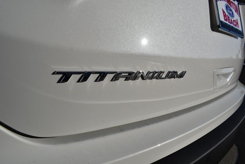 2024 Ford Edge Titanium in a Star White Metallic Tri Coat exterior color and Medium Soft Ceramicinterior. BEACH BLVD OF CARS beachblvdofcars.com 